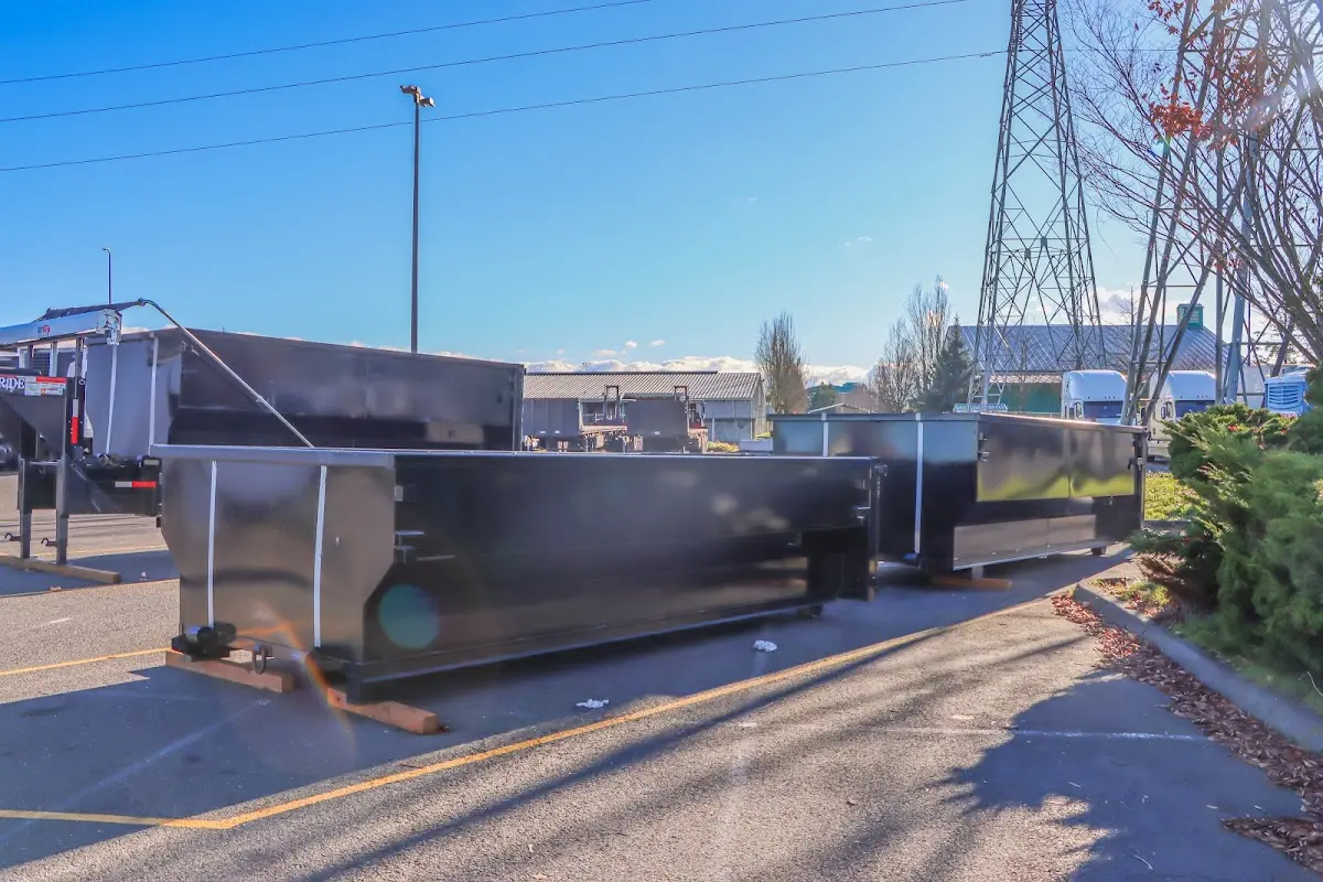 Roll-off dumpster ready for waste disposal at job site for Concrete Dumpster Rental in Clinton